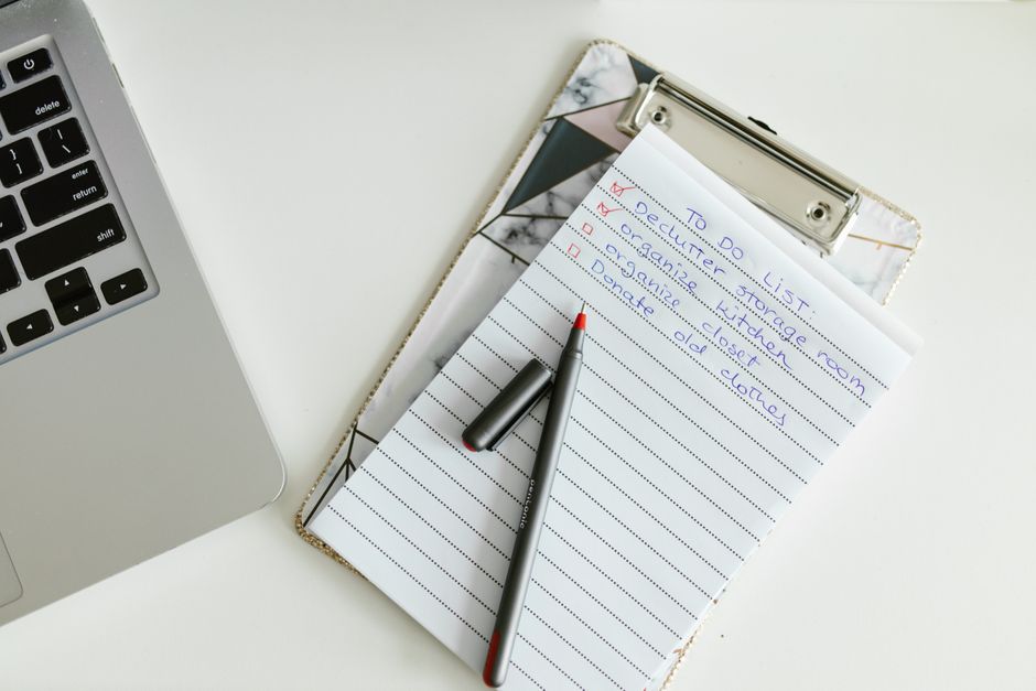 A comprehensive AI review checklist laid out on a clipboard next to a laptop, emphasizing the structured approach to quality assurance.