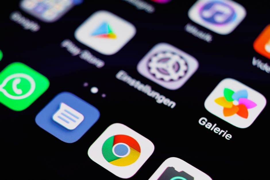 A grid of various app icons on a smartphone or tablet screen, some highlighted or deleted, symbolizing the process of managing and decluttering applications.