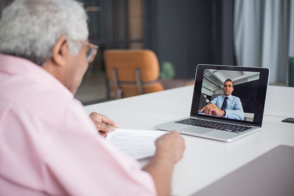 An independent consultant engaged in a focused video call with a client, demonstrating direct communication for feedback.