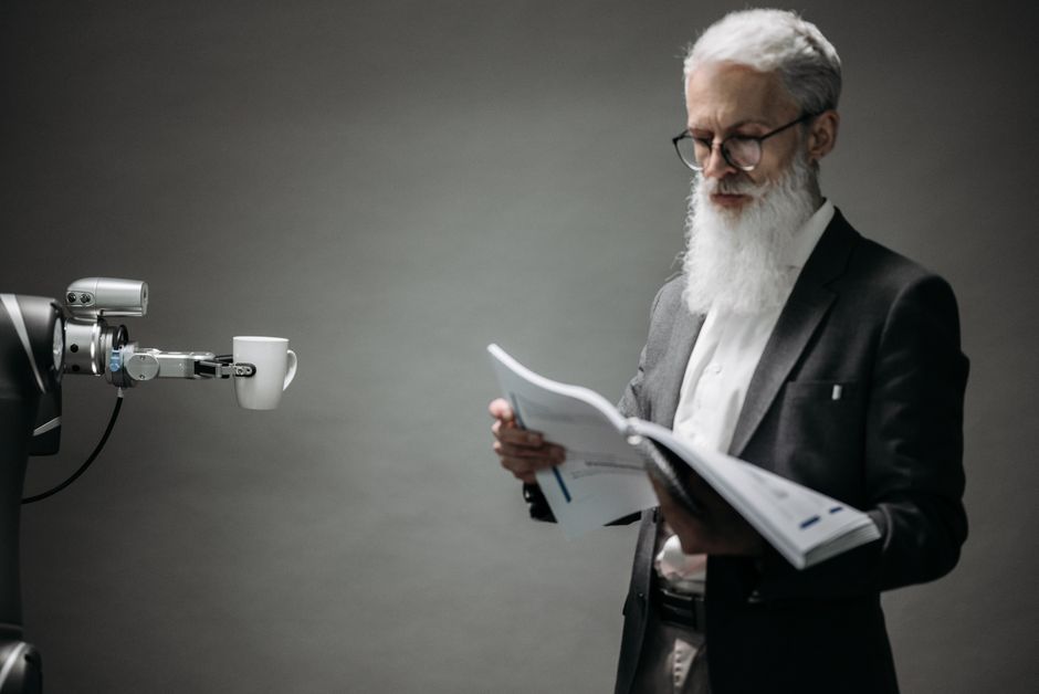 Two hands, one human and one robot (conceptual), collaboratively editing a document on a screen, illustrating the partnership between human insight and AI assistance in refining a brief.