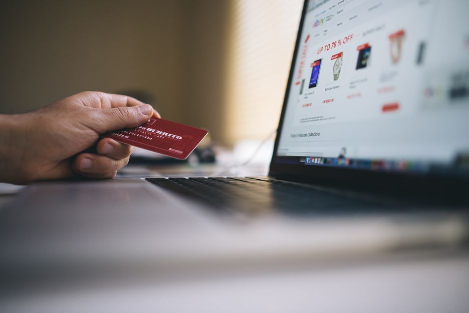 A clean, modern laptop screen displaying an e-commerce website with product listings, symbolizing the digital storefront for a small online brand.