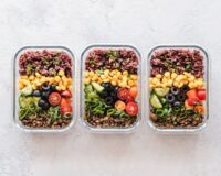 Organized meal prep containers with healthy food for a busy workweek