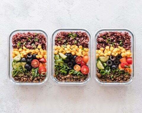 Organized meal prep containers with healthy food for a busy workweek