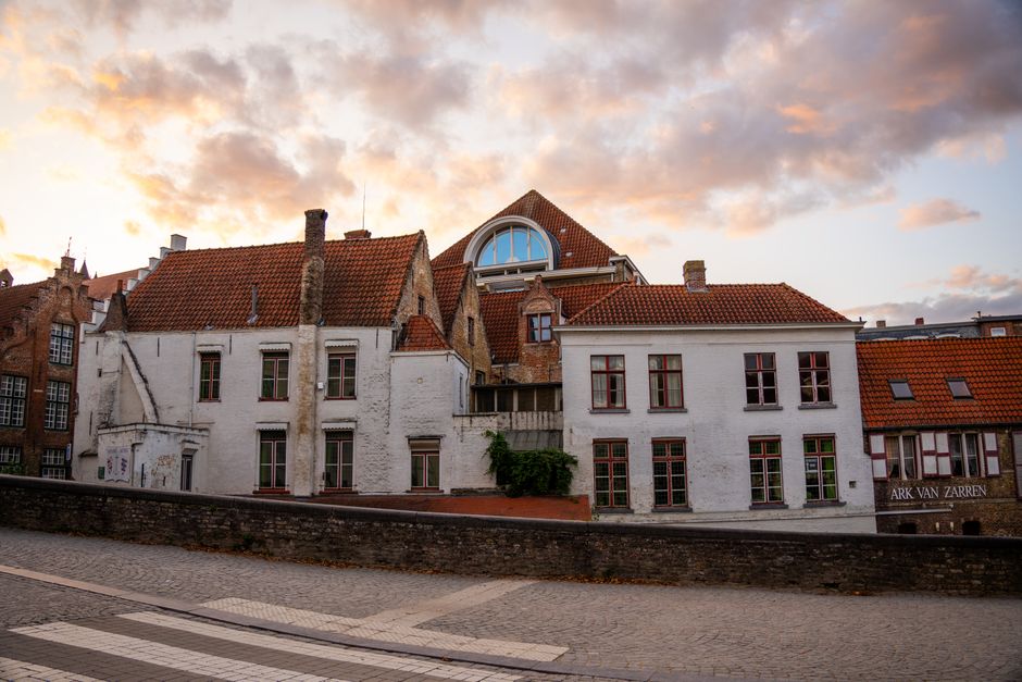 A charming, narrow cobblestone street in a historic European city, representing a perfect home base.