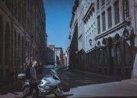Cobblestone streets of Old Montréal with historic buildings and horse-drawn carriages.