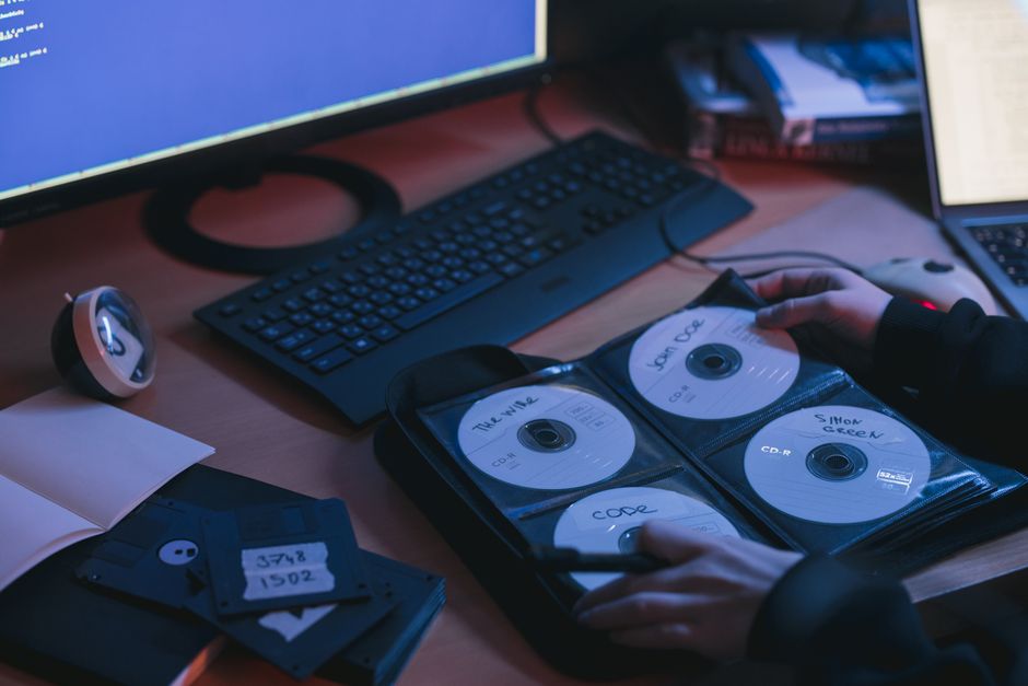 A person's hands efficiently organizing digital files on a tablet, symbolizing the structured management of a prompt library for repetitive business tasks.