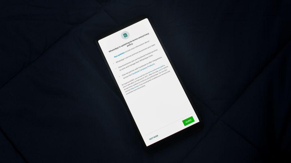 Close-up of a hand navigating privacy settings on a smartphone screen, emphasizing data protection.