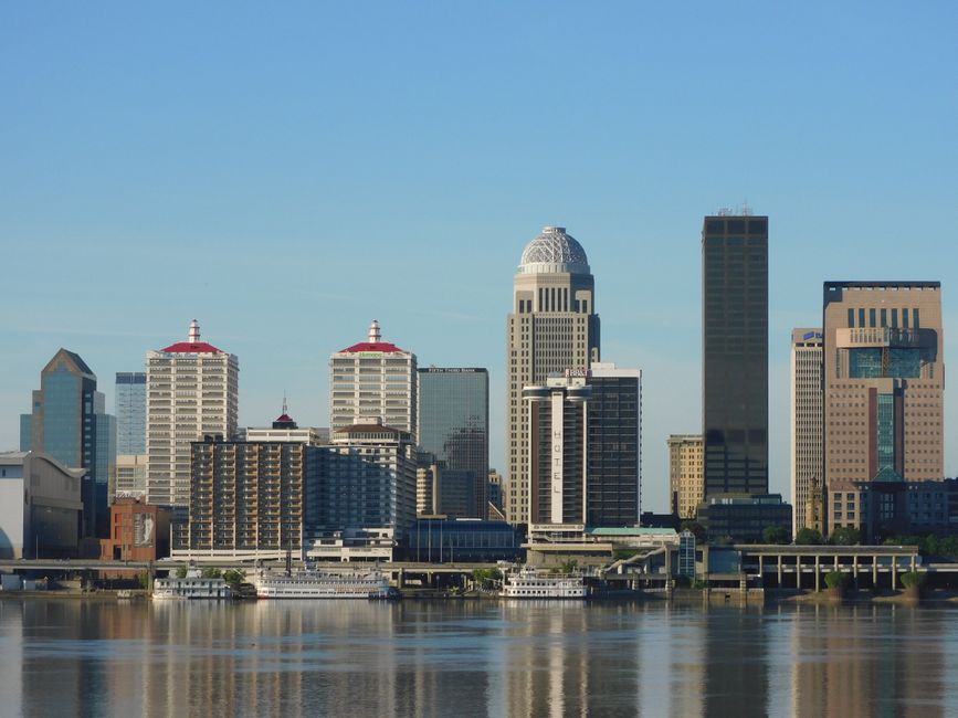 The modern Puerto Madero district of Buenos Aires with its unique bridge and skyscrapers reflecting in the wide canal.