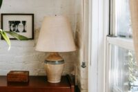 A cozy apartment living room with a floor lamp plugged into a smart plug, illustrating easy smart home integration for renters.